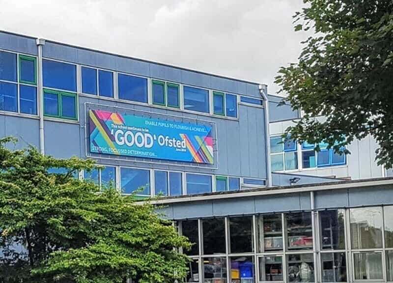 An image of an exterior banner for a school.